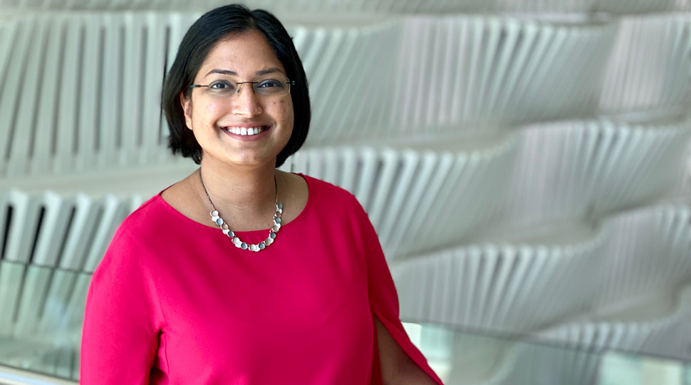 Valencia Albuquerque, Residences Manager, Four Seasons Private Residences Abu Dhabi at Al Maryah Island, smiles in front of a modern white wall