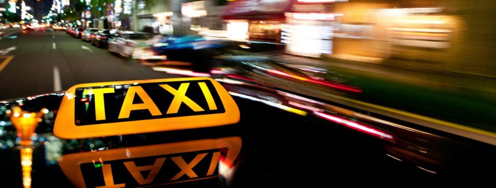 Taxi sign in city
