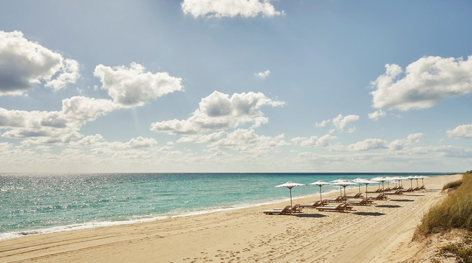 Beach chairs on the private beach of Four seasons Surf Club
