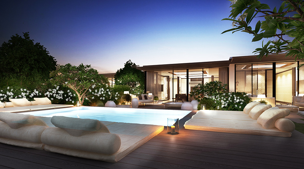 Night-time view of a private pool and villa