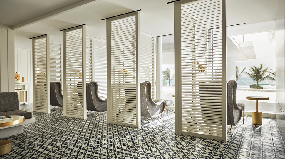 Four screened relaxation rooms overlook the pool
