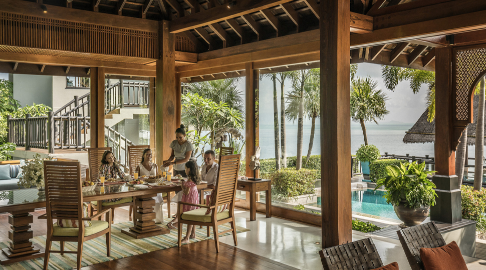 Open-air dining room leads out to private deck with pool